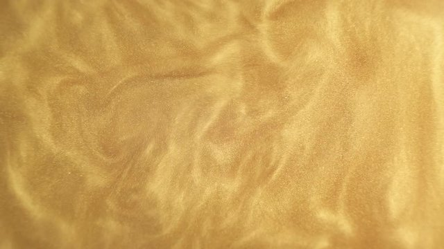 Rheoscopic fluid. Beautiful movement of particles in a liquid. Fantastic patterns and shapes.