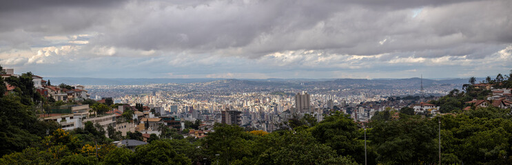 Sunset cityscape panorama with high rise buildings and skyscrapers of Belo Horizonte, capital of the state Minas Gerais in Brazil seen from the hills surrounding the urban conglomerate