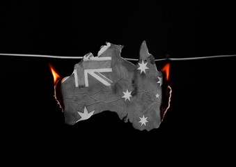 burning map of Australia on a black background  - Australia bushes wildfires 