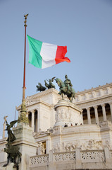 Fototapeta na wymiar Italian flag near Piazza Venezia Rome, Italy. Capitoline