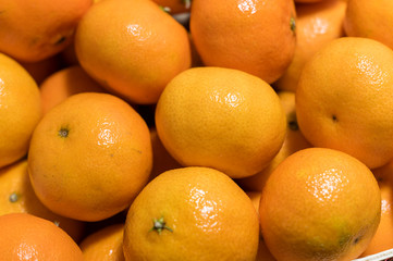 Wooden crate with orange tangerines.