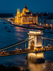 Budapest, Hungary, View of Parliament Building and Chain Bridge Over the Danube River at Night