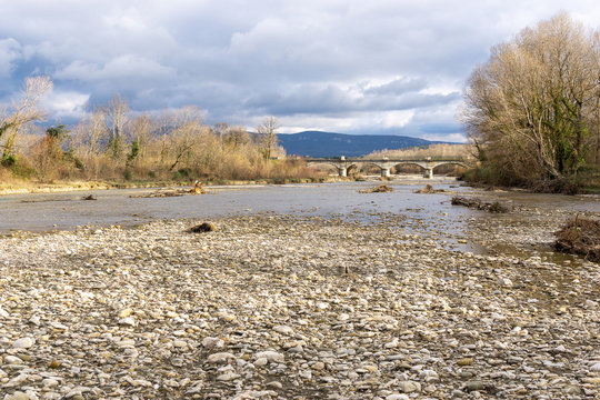 Roubion river in drome France. View of D74 river bridge. Saint-Gervais