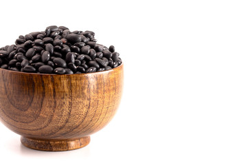 Fototapeta na wymiar Bowl of Dry Black Beans Isolated on a White Background