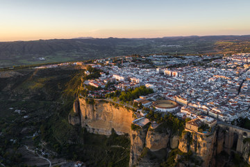 Aerial view of Ronda village, a village with white houses at the edge of cliffside in Andalusia, Spain