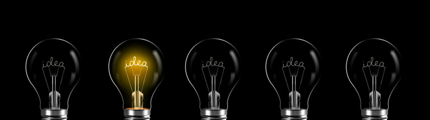 Creativity and innovation concept. idea word shining in the bulb - obrazy, fototapety, plakaty