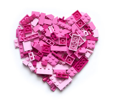 Pink heart made of blocks with white background. Love and Valentine Day concept