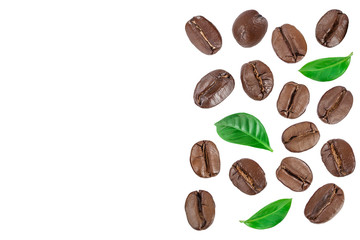 Heap of roasted coffee beans with leaves isolated on white background with copy space for your text. Top view. Flat lay.