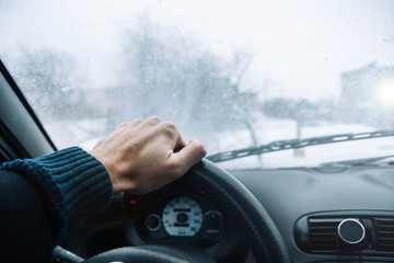 Naklejka premium Icy road winter road. Winter conditions on the road. View of the driver.