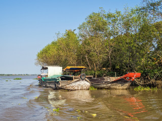 Traditional Mekong Delta freight boats - Vinh Long, Vietnam