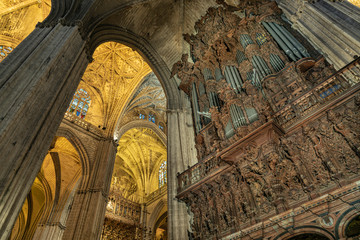 Pipe organ inside La Giralda in Seville, Spain. Huge wind instrument found in the Cathedral of...