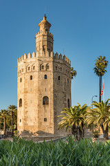Fototapeta na wymiar View of Golden Tower in Seville, Andalusia, Spain. Used as a military Moorish watchtower along the Guadalquivir river