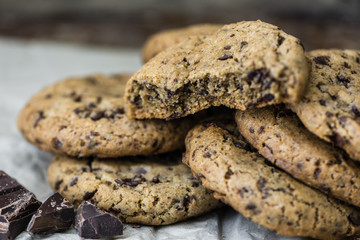 Freshly Baked Chocolate Cookies on Baking Paper. Sweet Biscuits. Homemade pastry.