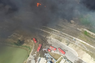 Oil storage fire. The tank farm is burning, black smoke is combu