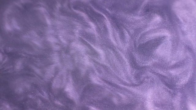 Rheoscopic fluid. Beautiful movement of particles in a liquid. Fantastic patterns and shapes.