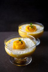 Sweet tapioca pudding with coconut milk and fresh mango flowers