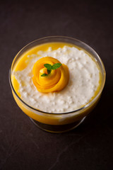 Sweet tapioca pudding with coconut milk and fresh mango flowers