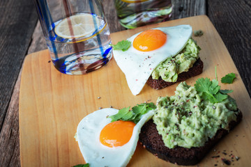 Brunch on Valentine's Day,  avocado toasts with fried egg