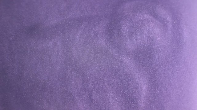 Rheoscopic fluid. Beautiful movement of particles in a liquid. Fantastic patterns and shapes.