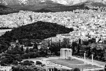 Athens, Greece: black and white photo of the Temple of Olympian Zeus and landscape of the city, the Olympieion, Columns of the Olympian Zeus seen from the Acropolis