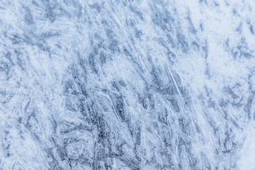 Ice texture, interesting frozen lake patterns, naturally created forms. Frozen river's water in the winter in mount Vitosha, near Sofia, Bulgaria. Ice Age climate changes.