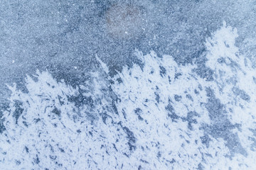 Ice texture, interesting frozen lake patterns, naturally created forms. Frozen river's water in the winter in mount Vitosha, near Sofia, Bulgaria. Ice Age climate changes.