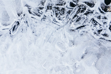 Ice texture, interesting frozen lake patterns, naturally created forms. Frozen river's water in the winter in mount Vitosha, near Sofia, Bulgaria. Ice Age climate changes.