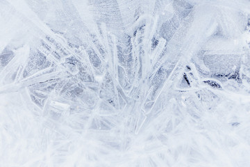 Ice texture, interesting frozen lake patterns, naturally created forms. Frozen river's water in the winter in mount Vitosha, near Sofia, Bulgaria. Ice Age climate changes.
