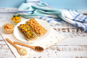 Sandwiches with hummus on white wood background. Vegetarian meal concept. Lenten menu