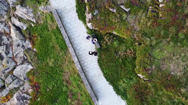 Drone descending above a group of friends