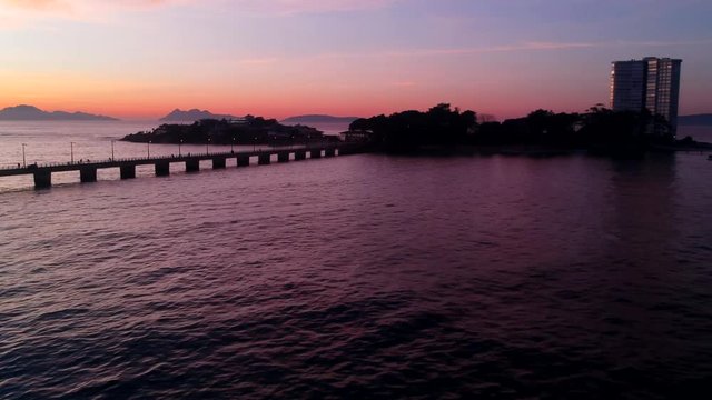 Drone flying above the ocean in Vigo, Spain rotating past the Toralla Island
