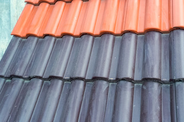 Samples of ceramic roofing tiles in a warehouse of a roofing mat