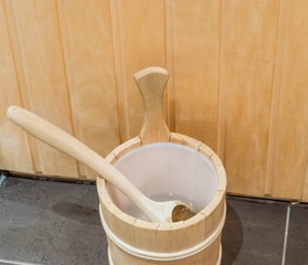 Fototapeta na wymiar Sauna Bucket with wooden Trowel