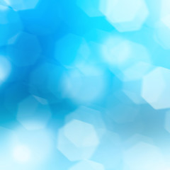 Blue bokeh lights abstract background. Bokeh on the background blurred the natural blue and white.