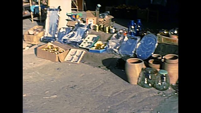 Handmade products and terracotta pots on the street shops of Haifa city by the Mediterranean sea. Historical archival footage in the 1970s of Israel.