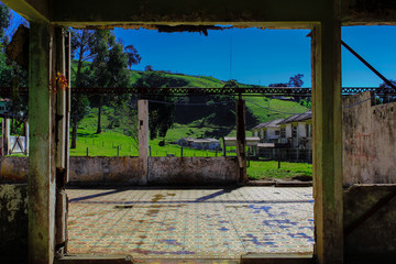 Fototapeta na wymiar Old and ruin room with the mountains in back. Part of 