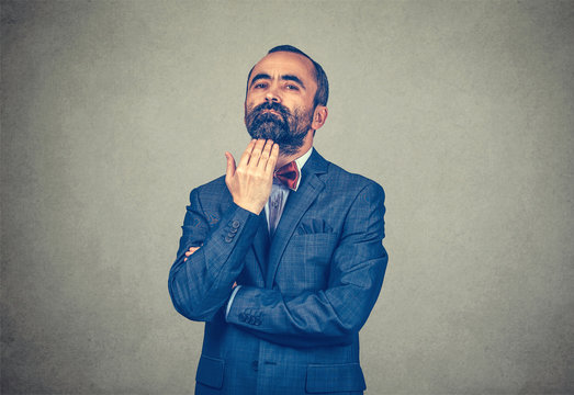 man hand at chin showing indifference I do not care