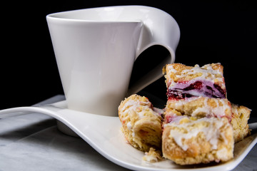modern design of cup of coffee or tea  and cake on table