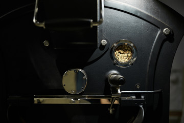 Technology and equipment for processing coffee. Modern professional equipment for roasting coffee. Close-up.