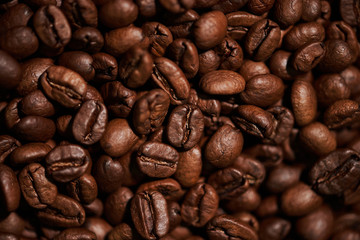 Freshly roasted brown coffee beans. Close-up.