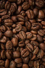 Brown roasted coffee beans. Background.