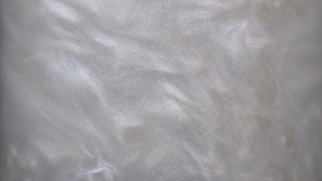Rheoscopic fluid. Beautiful movement of particles in a liquid. Fantastic patterns and shapes. 50 fps
