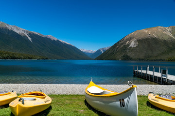 Fototapeta na wymiar boat on the lake mountains view