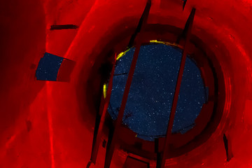View of the starry sky through opening of the water tower. Stars