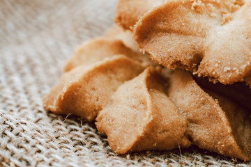 Close-up macro cookies baking on wooden bowl background.