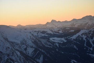Fototapeta na wymiar Snowy mountain sunset scene