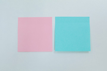 Set of Blank office sticky notes in a line up of empty editable paper memos as business communication and employee social networking with pink and blue 
