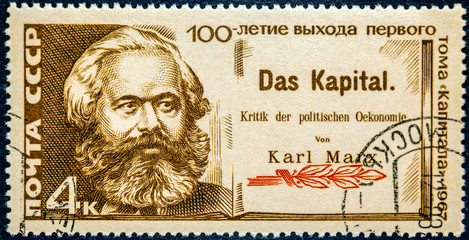 Mail stamp printed in the USSR (CCCP) featuring a portrait of socialist revolutionary Karl Marx...