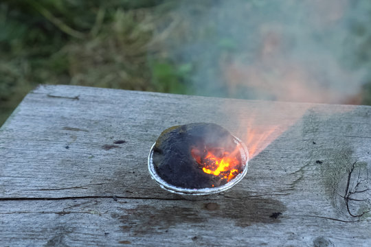 Burning chemical in the cup.