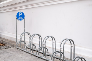Bicycle parking sign in public park.